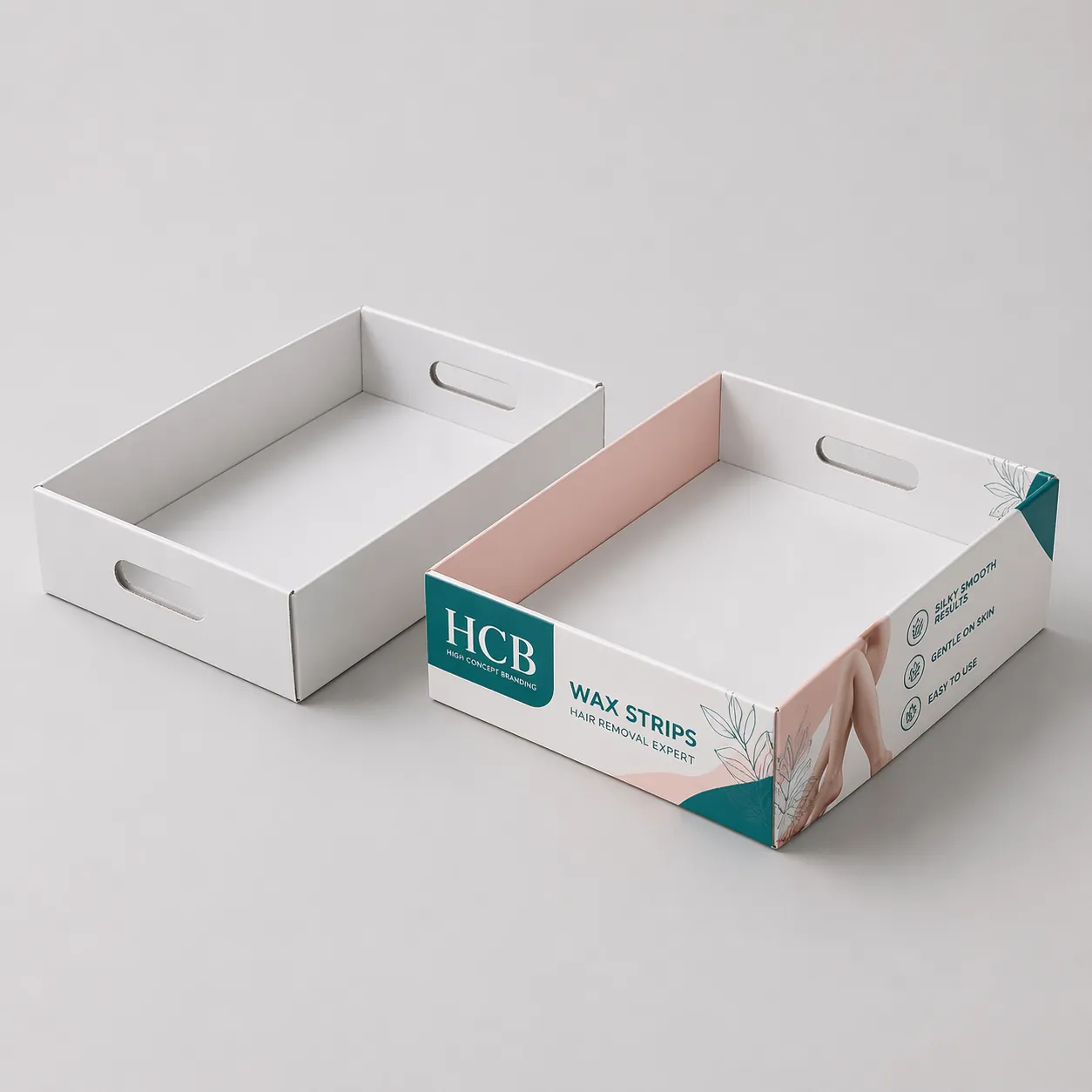 Two cardboard display trays with upright back panels, featuring elegant pink floral designs and logos. class=